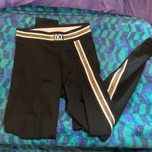 Ivy Park leggings black with glitter stripe twisted around one leg